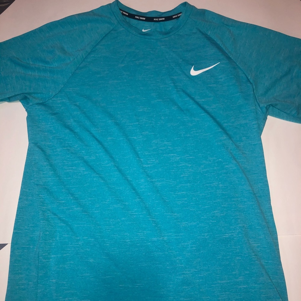 Never worn teal blue nike swim dri-fit tee shirt